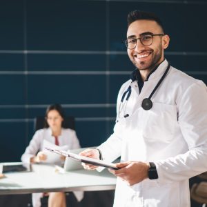 cheerful-male-doctor-in-medical-uniform-working-in-hospital.jpg
